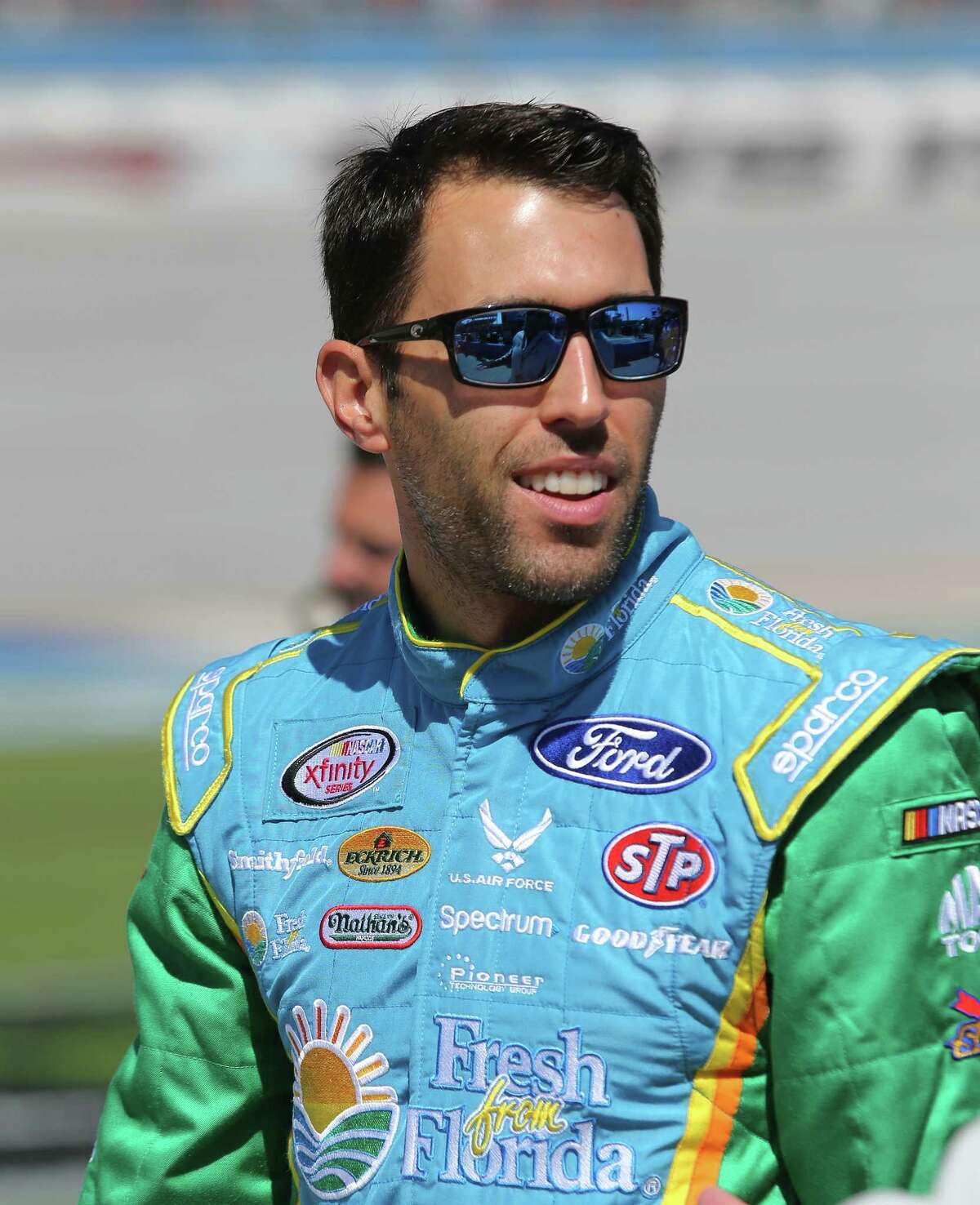 TALLADEGA, AL - MAY 06: Aric Almirola, driver of the #98 Fresh from Florida Ford, stands on the grid during qualifying for the NASCAR XFINITY Series Sparks Energy 300 at Talladega Superspeedway on May 6, 2017 in Talladega, Alabama. (Photo by Jerry Markland/Getty Images)