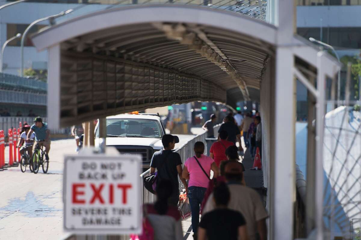 People enter the Laredo Port of Entry foot bridge on the US/Mexico border in Laredo, Texas, on February 22, 2017. Click ahead to see the biggest drug busts at the Texas-Mexico border.
