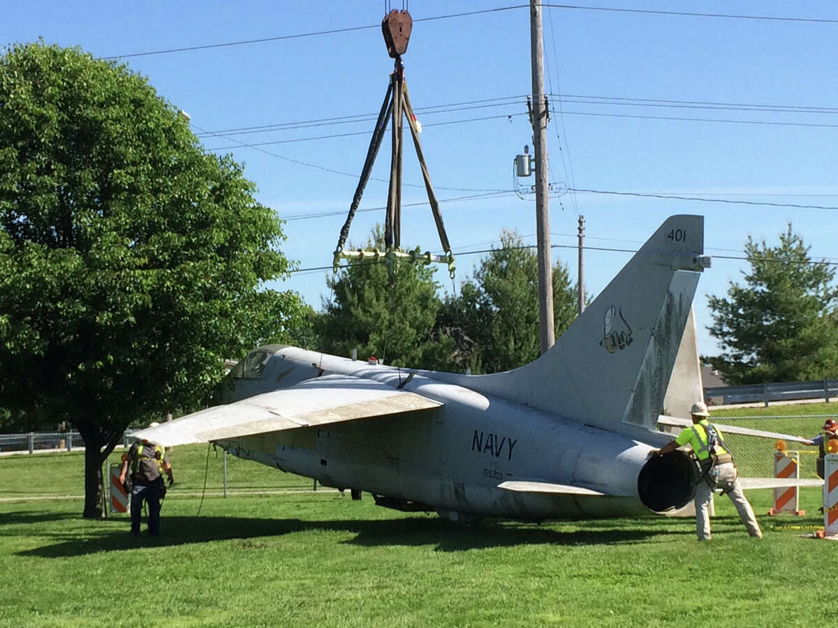 The U.S. Navy A7E Corsair on display at the Robert C. Stille Edwardsville Township Community Park was being lowered from the display pylon by Keller Construction so restoration work can begin.  The aircraft has remained on the pylon since it was originally installed in Township Park by Keller Construction in 1991. In October, Edwardsville Township approved a contract with the Flight Deck Veterans Group, a nationwide nonprofit organization based in Tennessee for the restoration of the historic aircraft on display at Township Park.  The Flight Deck Veterans Group restores aircraft as a part of its mission of veterans serving veterans and to pass on the history and legacy of veterans and flight deck operations.