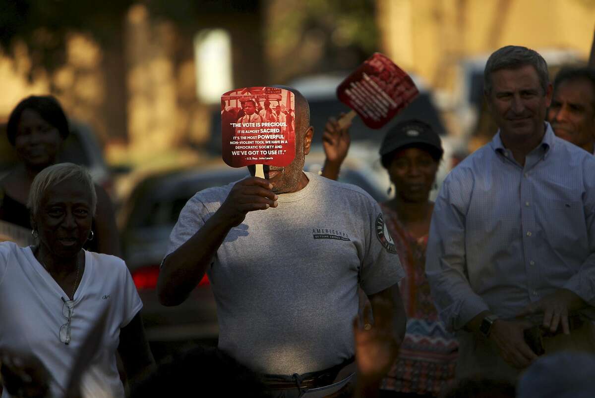 FILE-- People attending a voting rights protest organized by Democracy North Carolina in Fayetteville, N.C., Aug. 25, 2016. The Supreme Court on May 15, 2017, announced that it would stay out of a fight over a restrictive North Carolina voting law. The move left in place a federal appeals court ruling that struck down key parts of the law as an unconstitutional effort to 'target African Americans with almost surgical precision.' (Travis Dove/The New York Times)