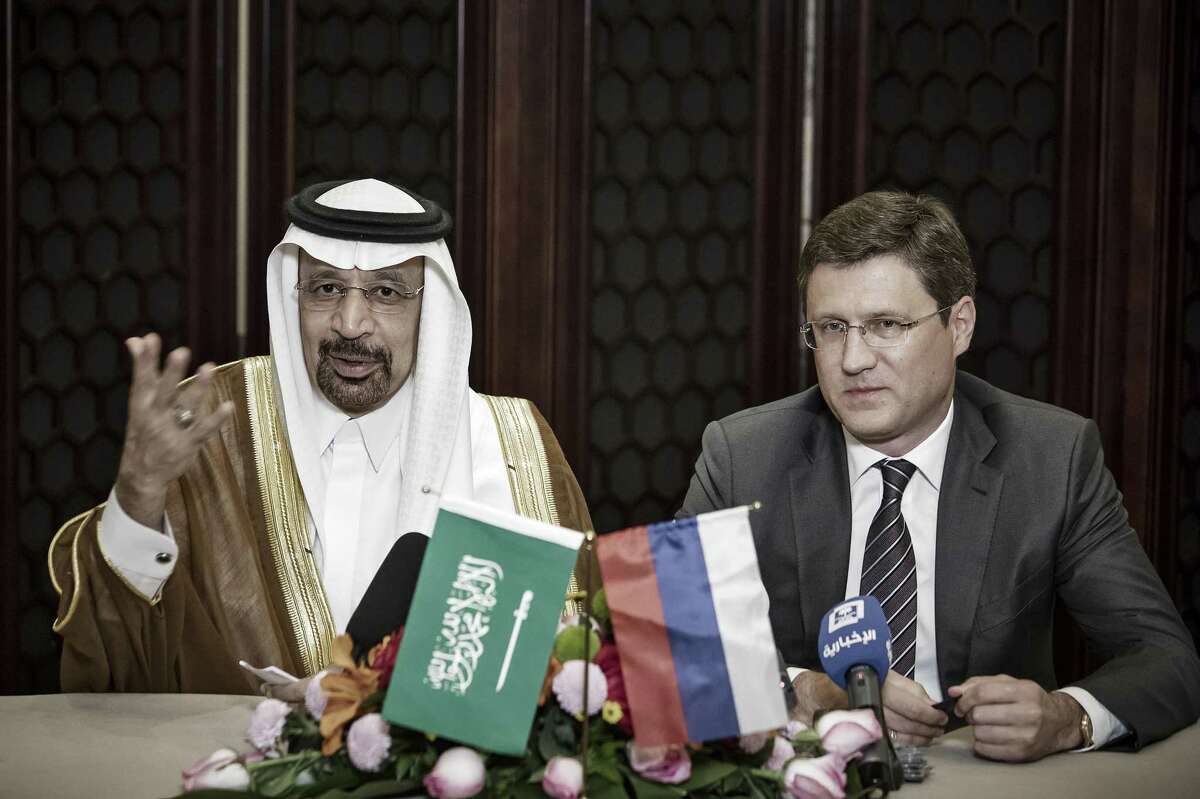 Khalid Bin Abdulaziz Al-Falih, Saudi Arabia's energy minister, left, speaks as Alexander Novak, Russia's energy minister, looks on during a news conference on the sidelines of the Belt and Road Forum for International Cooperation in Beijing, China, on Monday. The two countries said they would support extending 1.8 million barrels in oil production cuts that were set to expire in June.