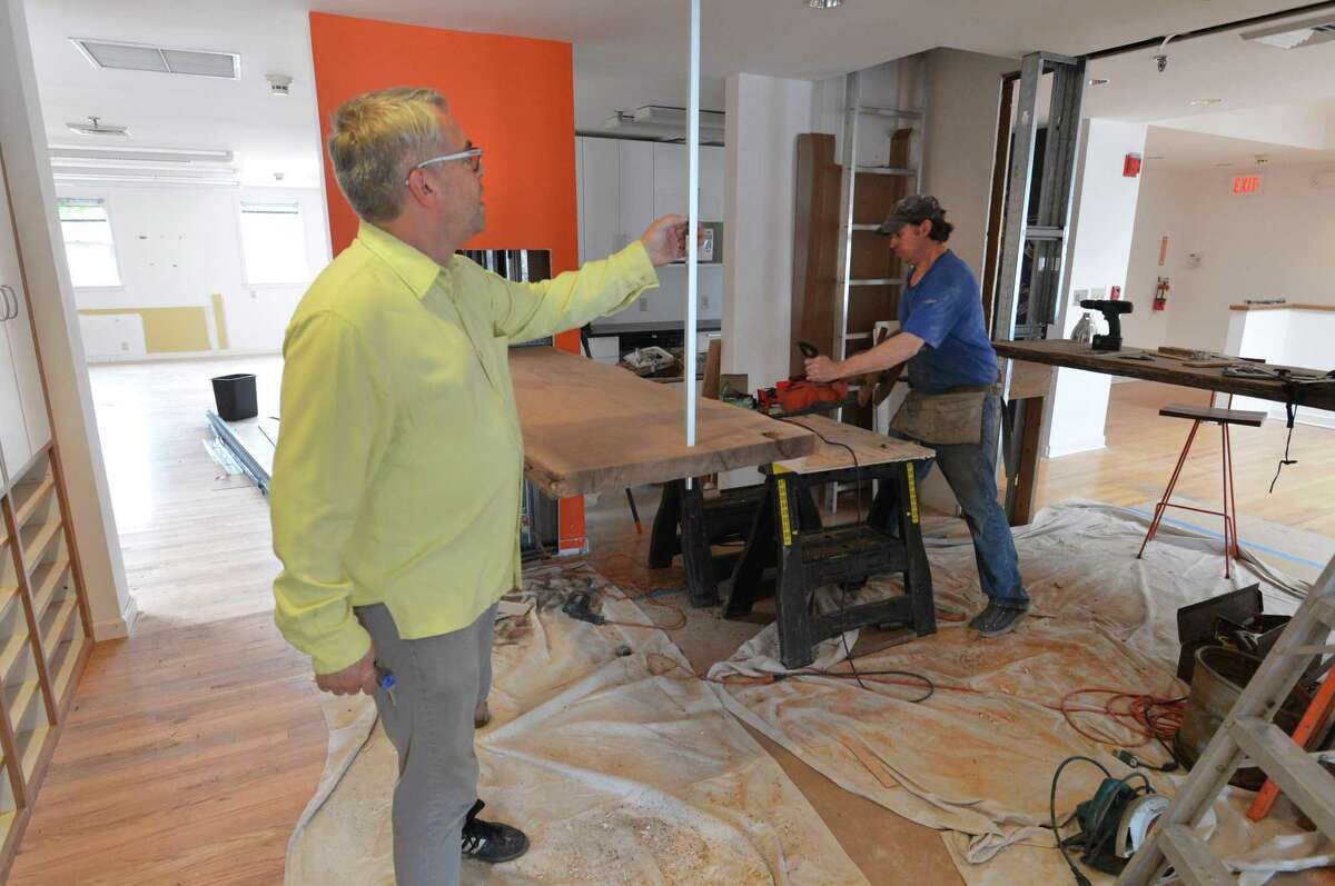 Co-founder Karl Heine checks on the construction progress of the walnut counters in the kitchen area at the new Sono Spaces on South Water Street in Norwalk. The new co-working facility will be in the center of SoNo and have the most up-to-date amenities.