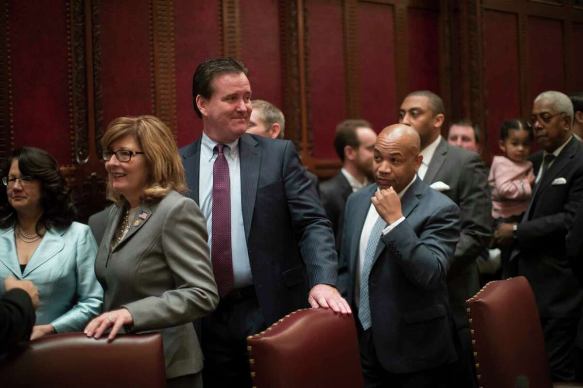 FILE -- New York Republican State Senator Pamela Helming, left, in the New York State Senate chamber at the state Capitol, in Albany, N.Y., Jan. 4, 2017. Helming and two other Republican state senators were falsely identified in March as the leaders of Senate committees in documents sent to the state comptroller by Senate payroll staff, resulting in the lawmakers receiving thousands of dollars in stipends meant for others. (Nathaniel Brooks/The New York Times) ORG XMIT: XNYT135