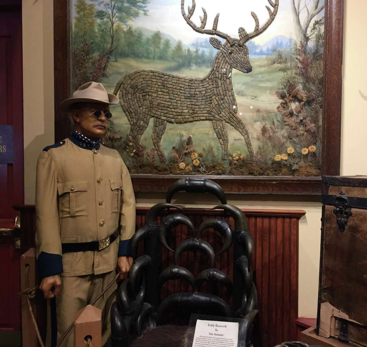 A wax figure of Teddy Roosevelt, one of the historic visitors to the Buckhorn Saloon and Museum, is displayed along with two gifts presented to the U.S. president in 1906 by owners Albert and Emilie Friedrich: a chair made from 52 sets of buffalo horns and a white-tailed deer picture fashioned from 637 rattlesnake rattles.