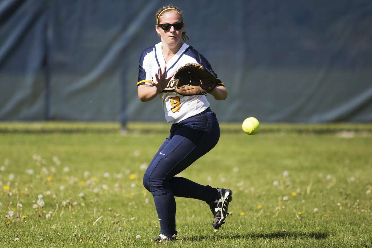 Midland's Paige Murphy fields a fly ball in a game against Coleman at Midland High School on Monday.