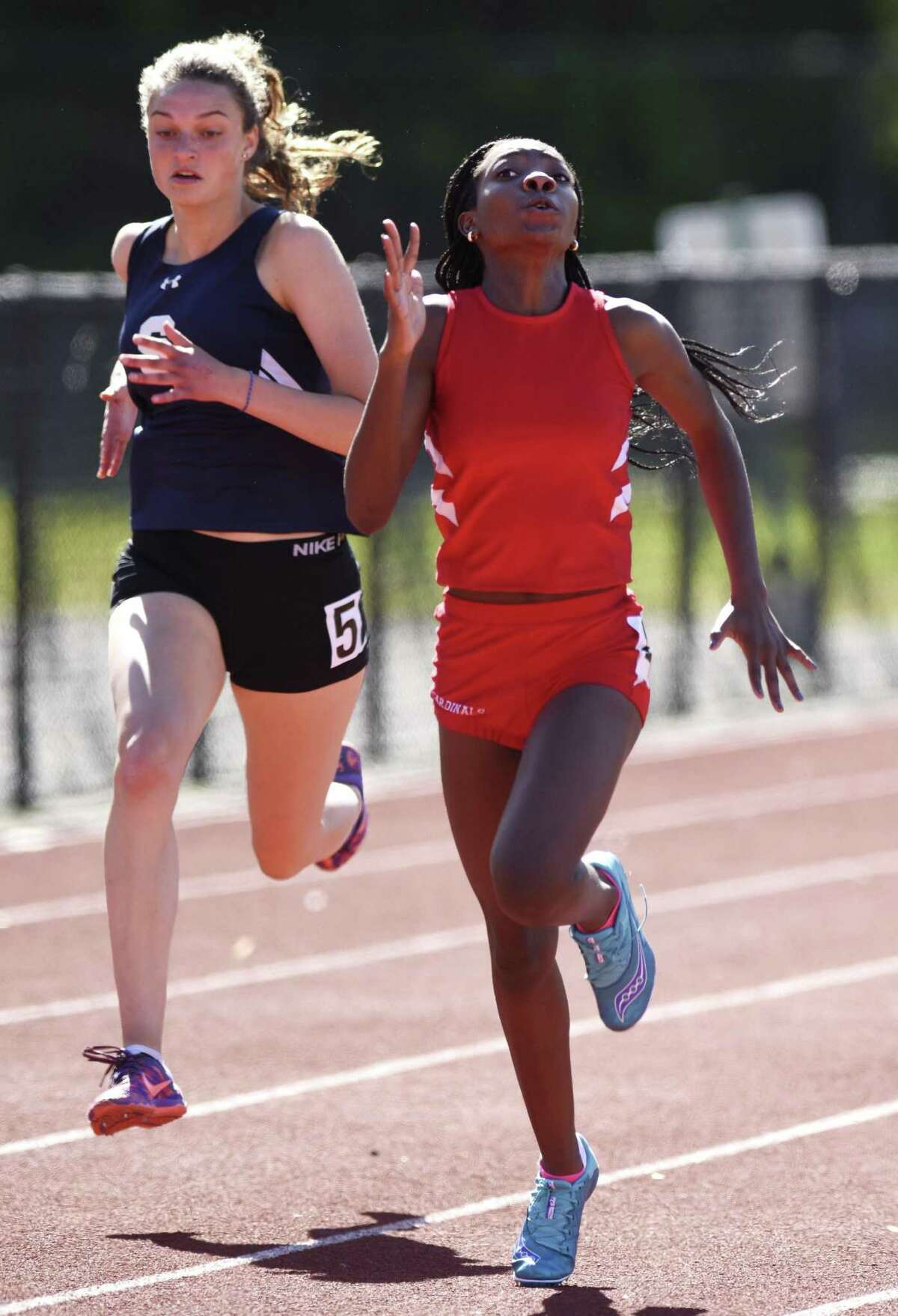 Greenwich freshman Jada Williams pulls away to win the 100 meter dash at the high school girls track and field meet between Greenwich and Staples at Greenwich High School in Greenwich, Conn. Monday, May 15, 2017.