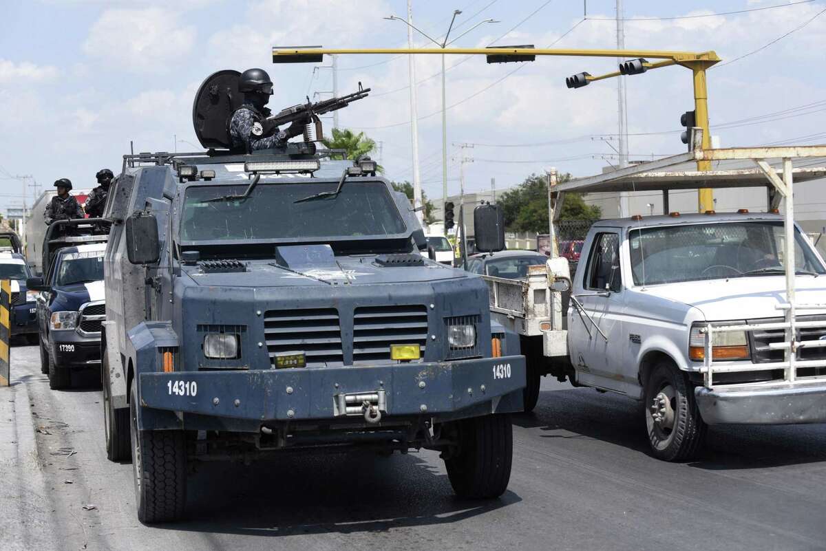 Mexican federal police in an armored truck patrol Reynosa, where drug violence has spilled into the streets nearly daily.