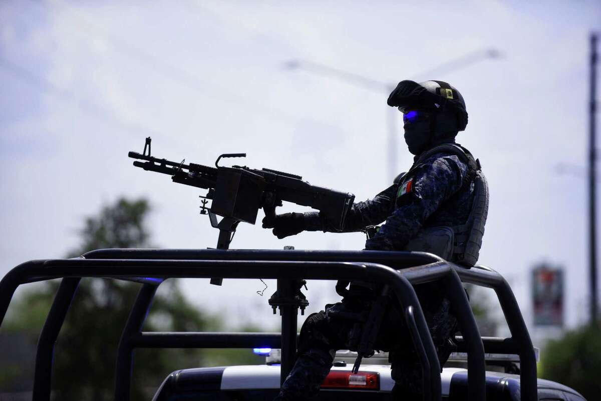 A federal police officer mans a weapon during a patrol in Reynosa, one of the most dangerous cities in Mexico.
