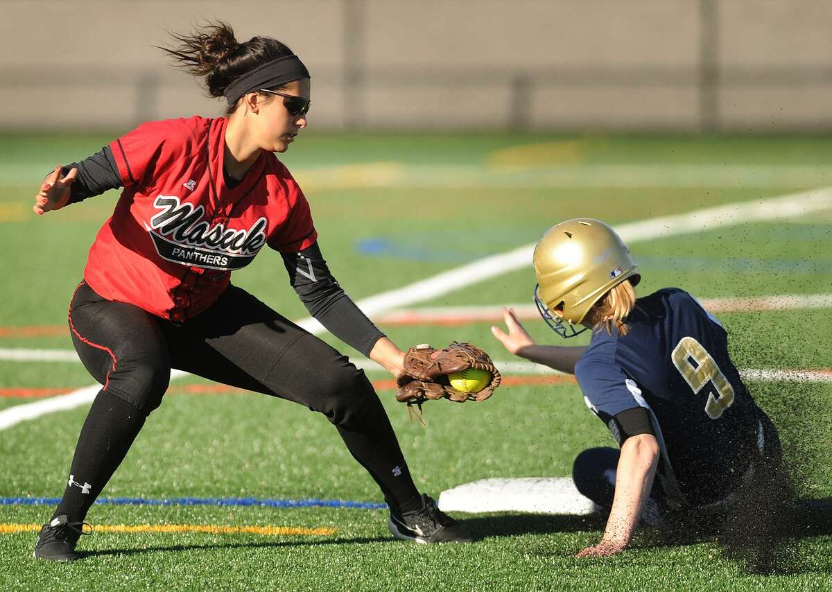 Notre Dame of Fairfield’s Lucy Grant steals second base ahead of the tag by Masuk shortstop Jenna Hall in the first inning of Monday’s game in Fairfield.