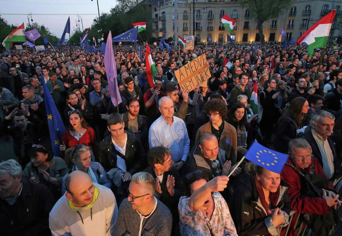 Thousands of Hungarians rally in Budapest on May 1, 2017 , chanting "Europe, not Moscow" in support of the EU and against Hungary's prime minister, whom protesters said is too close to Russia. The EU launched legal action against Hungary on April 27, setting up a major confrontation with Prime Minister Viktor Orban who accused Brussels of backing US billionaire investor George Soros instead of his country. Orban, an ally of Russia's Vladimir Putin, made his accusation one day before Soros was to meet European Commission chief Jean-Claude Juncker in Brussels. / AFP PHOTO / Istvan HUSZTIISTVAN HUSZTI/AFP/Getty Images