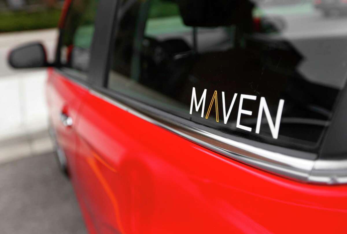 FILE - This April 27, 2016, file photo, shows the Maven logo on a General Motors car-sharing service automobile, in Ann Arbor, Mich. General Motors Co. launched its Maven car-sharing service in New York on Monday, May 15, 2017. The service lets members rent a variety of GM vehicles for whatever they need, from a 30-minute errand to a 28-day road trip. (AP Photo/Paul Sancya, File)