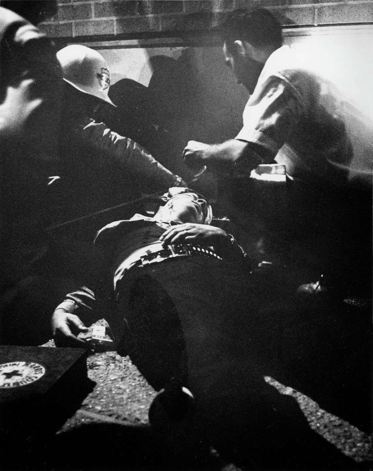 Houston Police officer Louis Kuba seconds after he was shot. The rookie officer died from a wound in the forehead as he prepared to charge with other officers a dormitory at TSU.