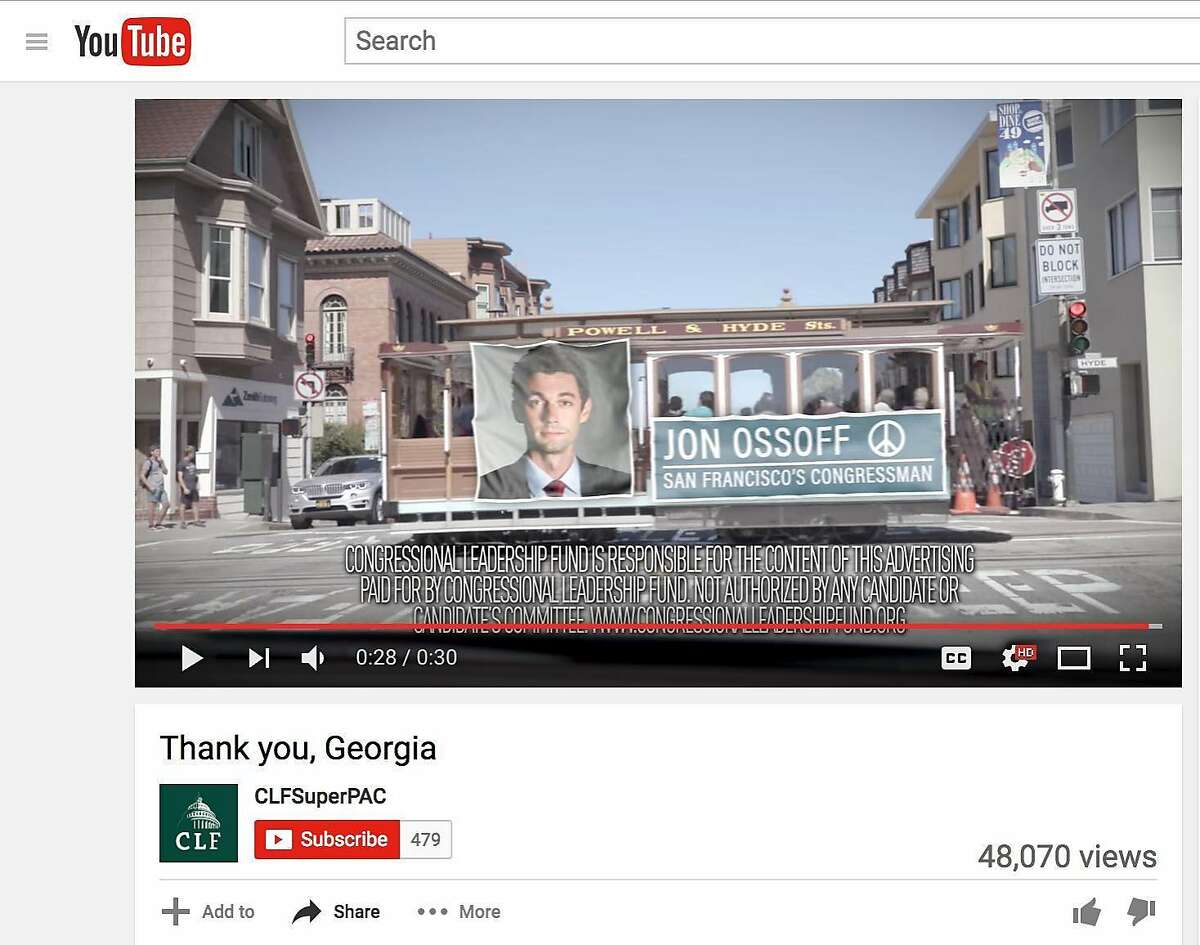 This screenshot from a Youtube video by CLFSuperPac shows a Jon Ossoff ad on a cable car.