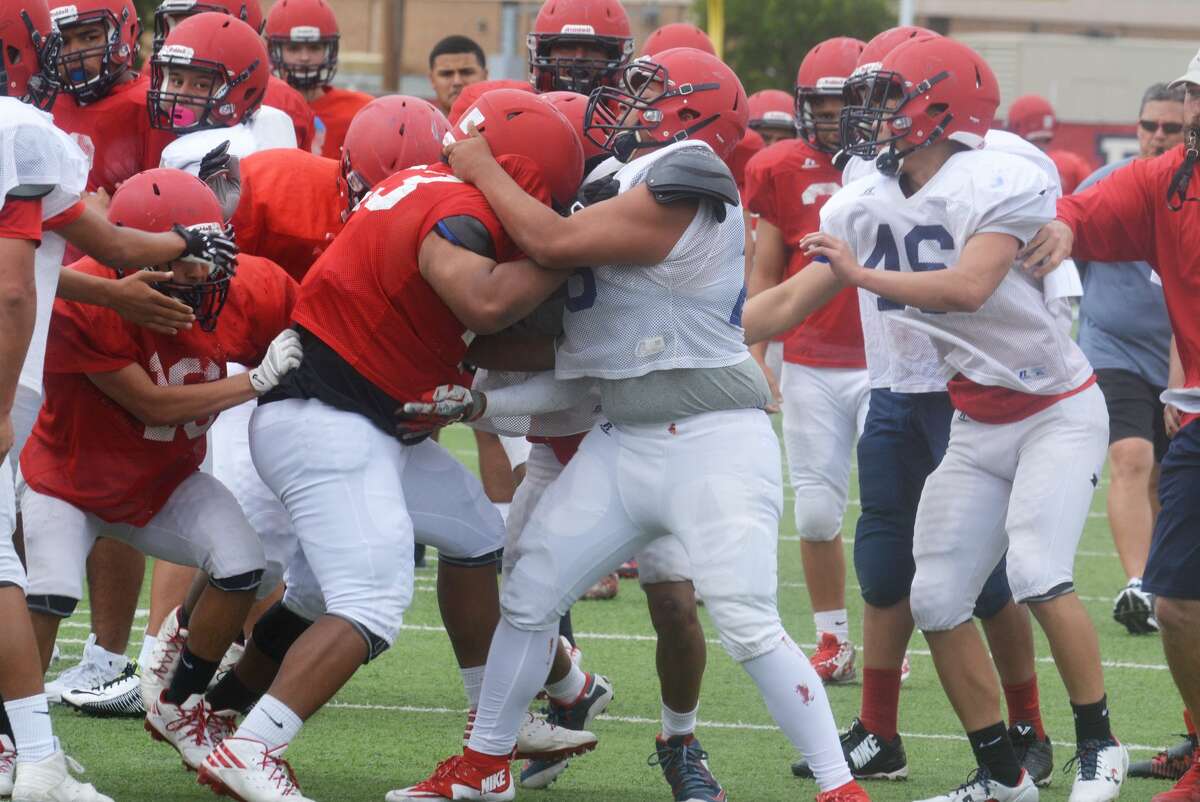 Plainview football players mix it up during a practice of what has been an intense and hard-hitting spring football campaign. 