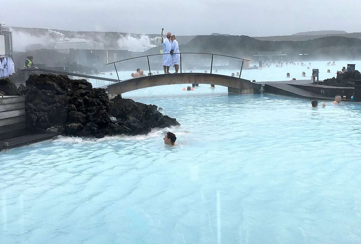 One of the most popular attractions in Iceland, the Blue Lagoon is a geothermal spa where visitors can swim and spread silica mud and algae masks on their faces. (Jessica Kwong/Orange County Register/TNS)