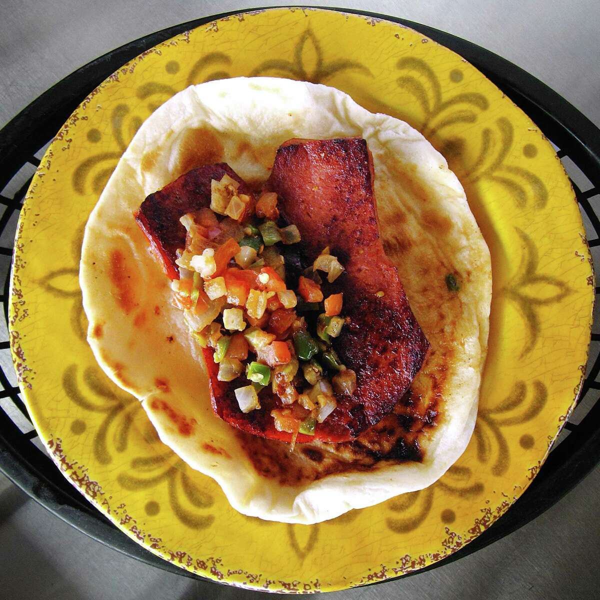 Country sausage link a la mexicana taco on a handmade flour tortilla from Tony's Tacos To Go.