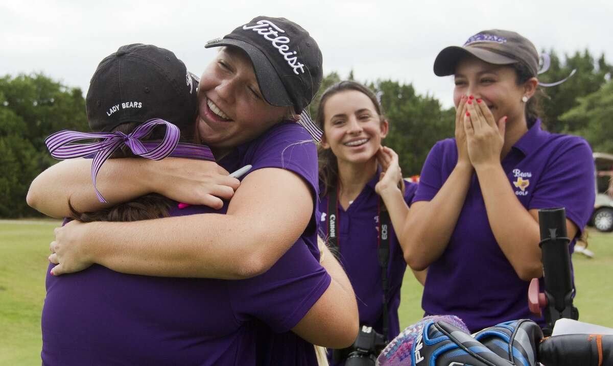 Hailee Cooper, second from left, hugs Erica Bartee as IIiana Stowers reacts after competing in the 6A girls UIL State Golf Championships at Legacy Hills Golf Club, Tuesday, May 16, 2017, in Georgetown.
