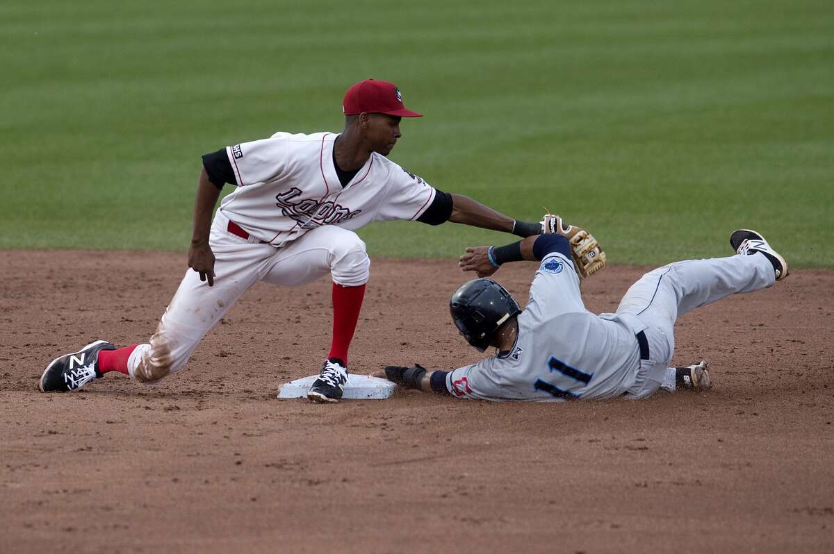 Loons' Brendon Davis tags out Lake County Captains' Jorma Rodriguez in the second inning of the Tuesday game.