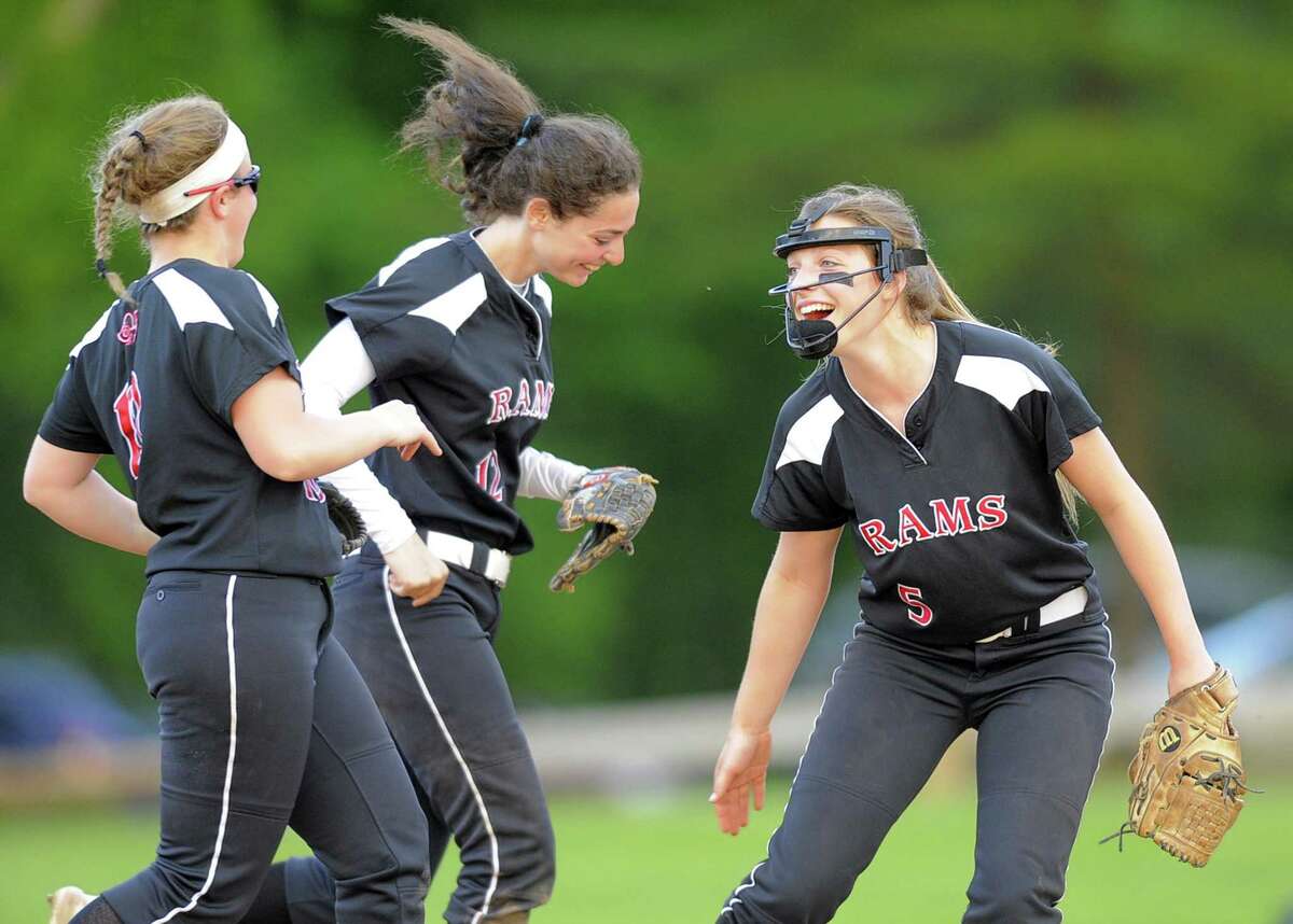 New Canann pitcher Gillian Kane, at right, reacts following teammate Kara Fahey, center, spectacular catch to end the fifth inning the Westhill bases loaded in a varsity girls softball game at Waveny Park in New Canaan on May 16, 2017. Westhill won 3-2.