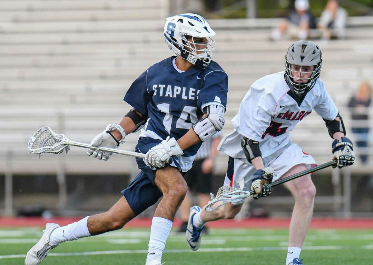 Max Lonrgan (14) of the Staples Wreckers drives toward the goal during a game against the Brien McMahon Senators at Brien McMahon High School on May 16, 2017 in Norwalk, Connecticut.