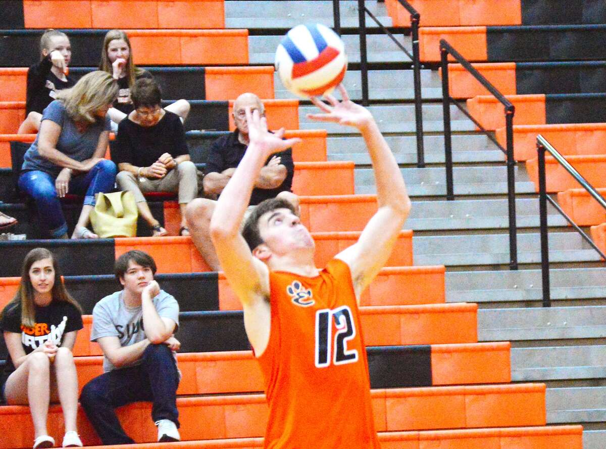 Edwardsville setter Ben Lombardi makes a pass during the first game against Belleville West on Tuesday inside Lucco-Jackson Gymnasium.