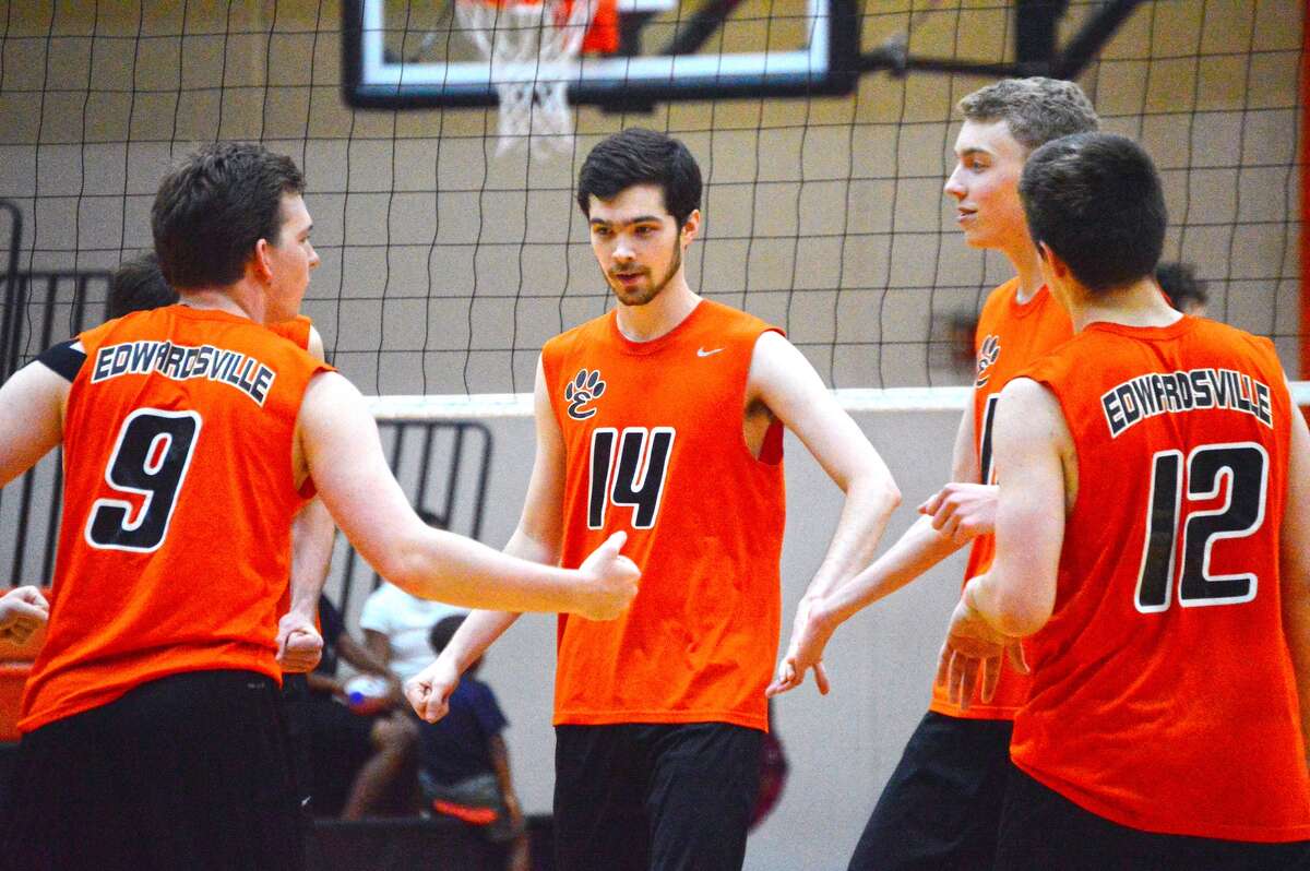 Edwardsville’s Joe Fitzgerald, center, is congratulated after an assisted block during the second game.