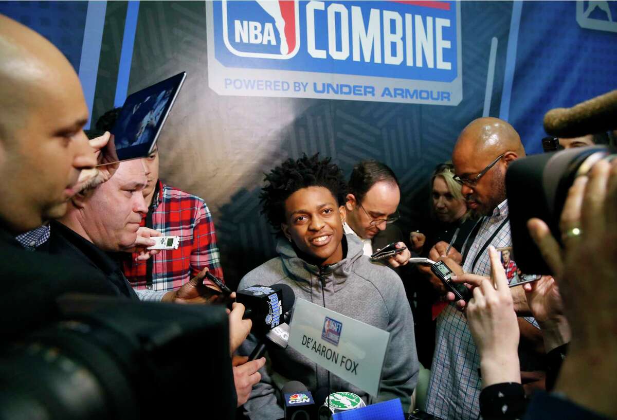 PHOTOS: What you should know about Houston's De'Aaron Fox, Justin Jackson and Johnathan Motley before the NBA Draft. De'Aaron Fox, center, from Kentucky, listens to a question at the NBA draft basketball combine Friday, May 12, 2017, in Chicago. (AP Photo/Charles Rex Arbogast)