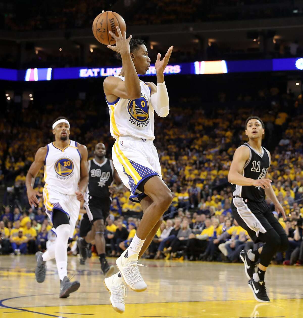 Golden State Warriors' Patrick McCaw makes a pass to James Michael McAdoo during Warriors' 136-100 win over San Antonio Spurs in Game 2 of NBA Western Conference Finals in Oakland, Calif., on Tuesday, May 16, 2017.