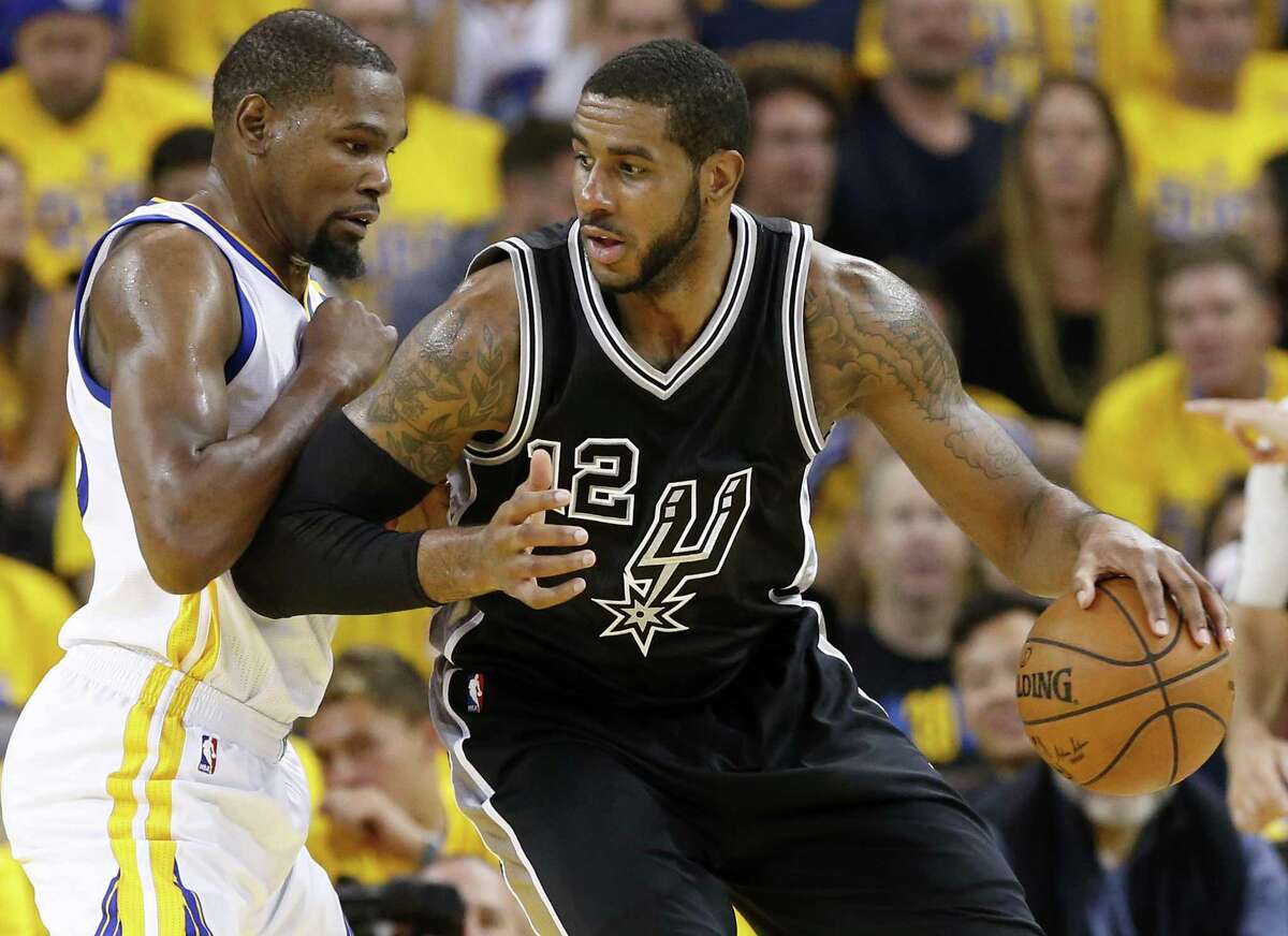 Golden State Warriors’ Kevin Durant defends the Spurs’ LaMarcus Aldridge during second half action in Game 2 of the Western Conference finals on May 16, 2017 at Oracle Arena in Oakland, Calif.