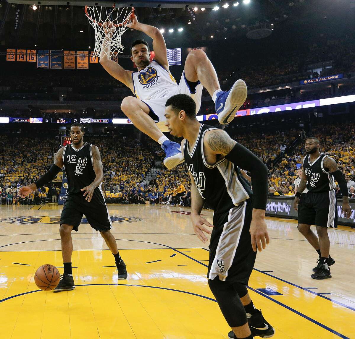 Golden State Warriors' Zaza Pachulia hangs on the rim during Game 2 of the 2017 NBA Playoffs Western Conference Finals at Oracle Arena on Tuesday, May 16, 2017 in Oakland, Calif.