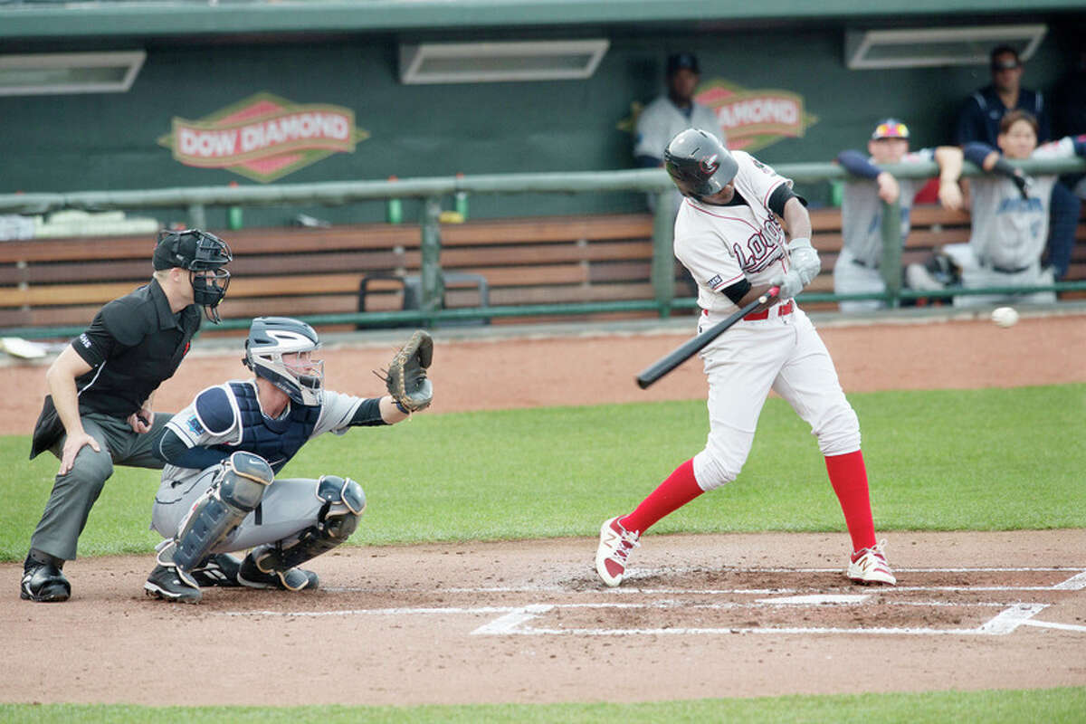 BRITTNEY LOHMILLER | blohmiller@mdn.net The Loons' Carlos Rincon swings at a pitch against Lake County on Tuesday at Dow Diamond.