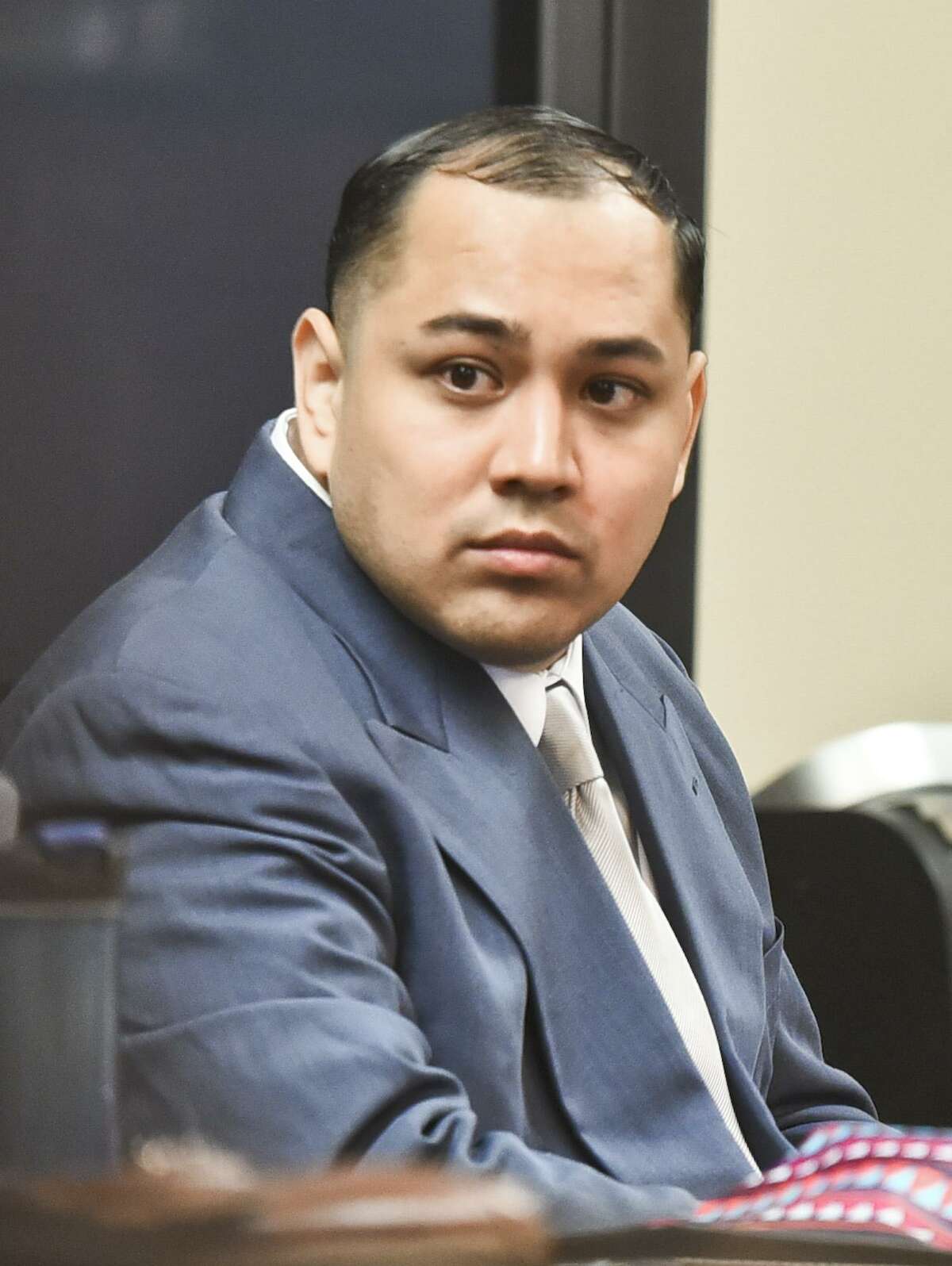 Cristian Yepez waits at the 406th District Courtroom as the defense and prosecution present opening arguments to Judge Oscar Hale on Tuesday, May 16, 2017.