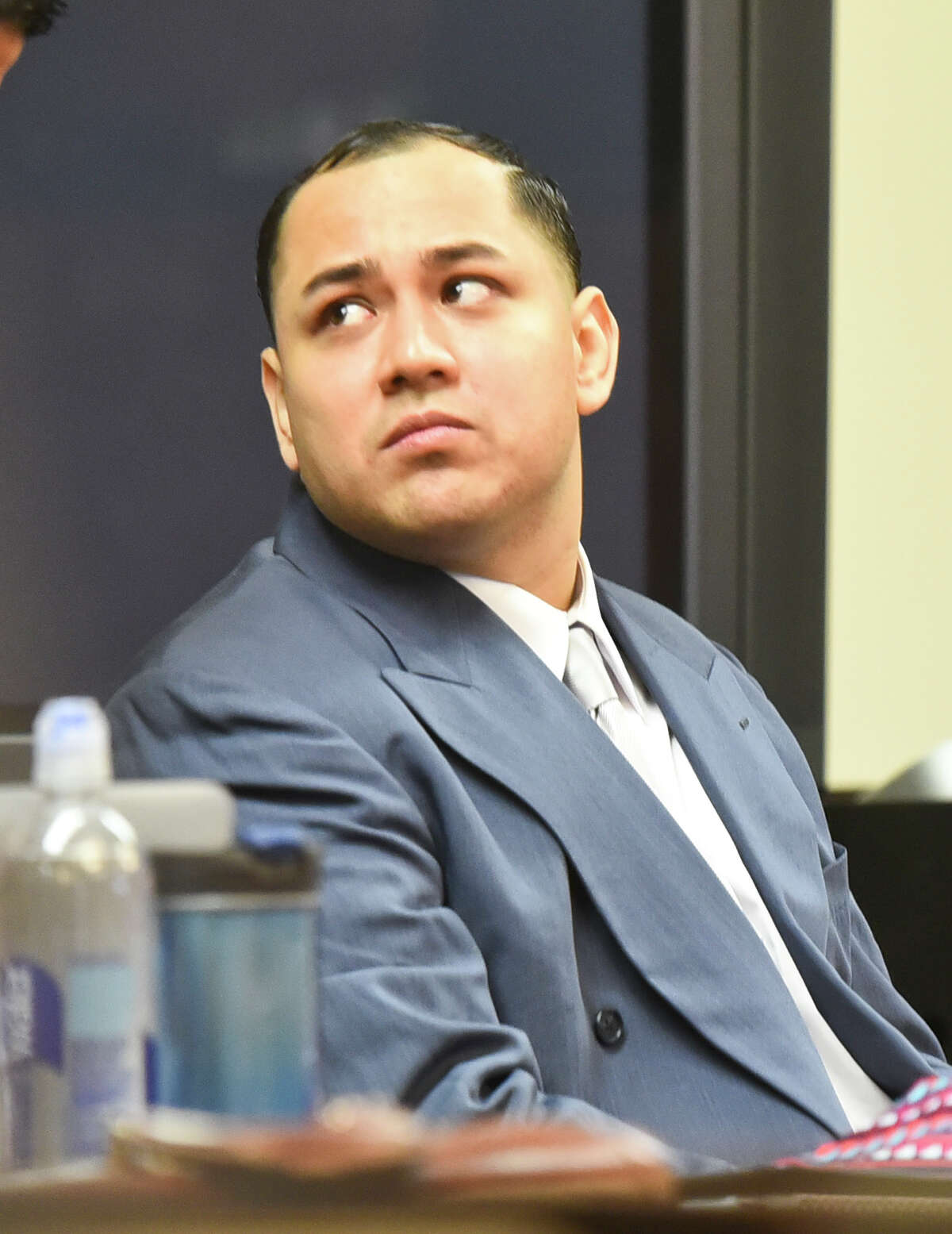 Cristian Yepez waits at the 406th District Courtroom as the defense and prosecution present opening arguments to Judge Oscar Hale on Tuesday, May 16, 2017.