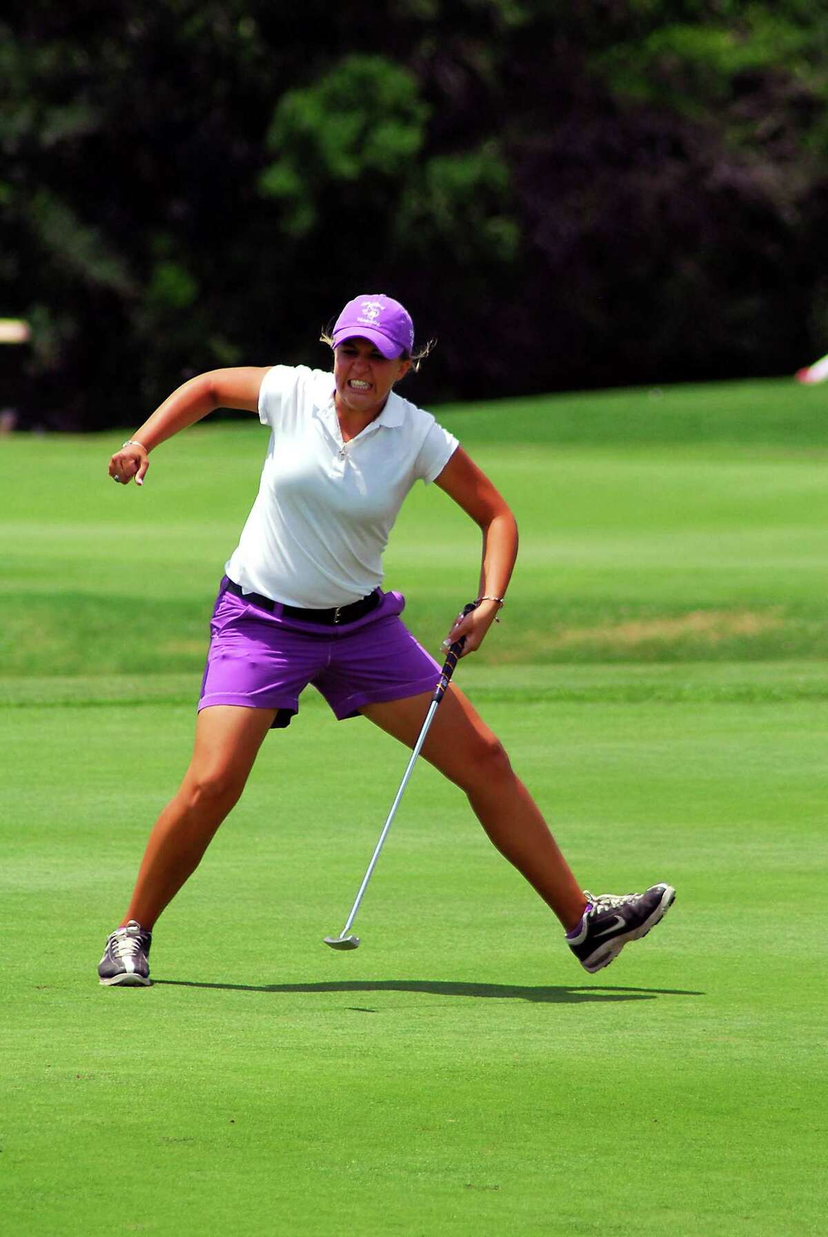 Montgomery Purple senior Abby Oberthier rolls home a par putt and celebrates a 68 to help Montgomery earn its seventh consecutive team 4A state title.