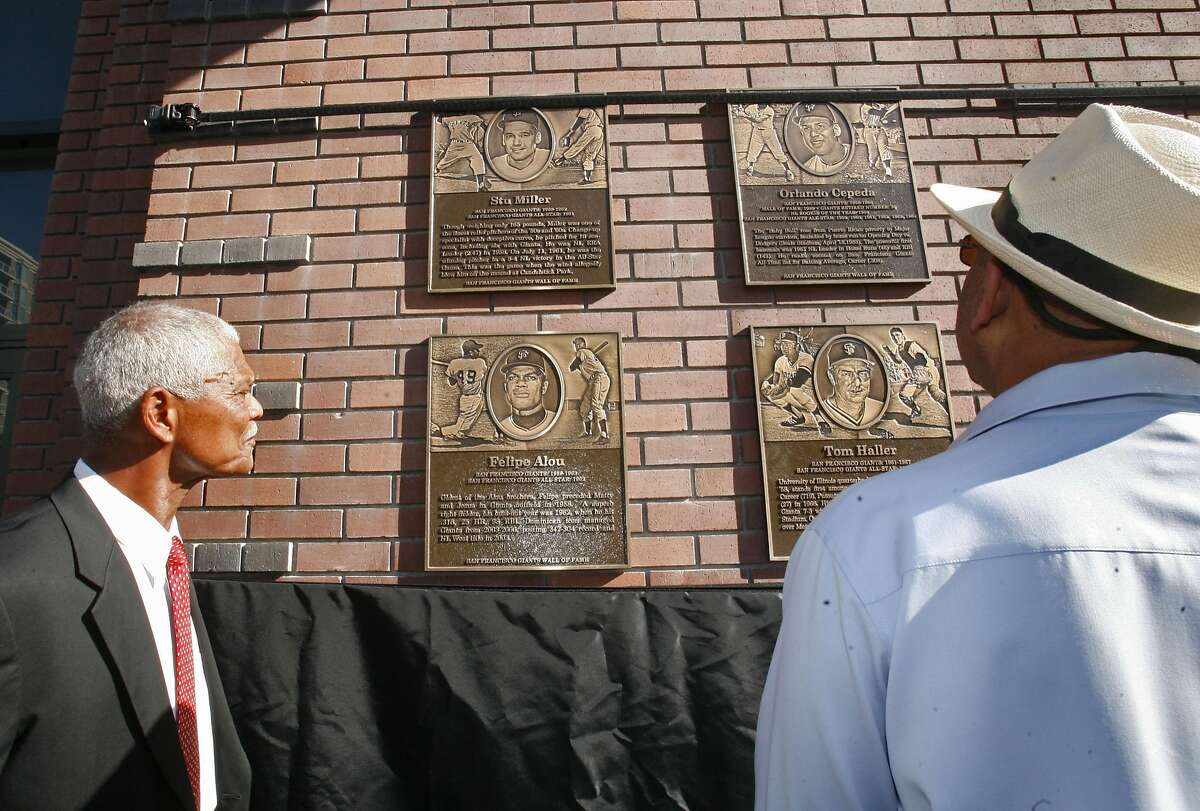 Felipe Alou, left, and Orlando Cepeda admire their plaques after the ceremony. The SF Giants unveil the Wall of Fame, a tribute to ex-Giants including Willie Mays, Willie McCovey, Orlando Cepeda, Gaylord Perry and many others. The ceremony took place near Willie Mays Plaza, outside AT&T Park in San Francisco, Calif., on Sept. 23, 2008.