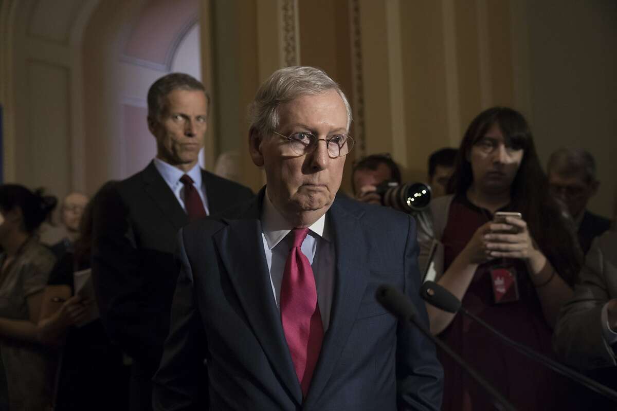 Senate Majority Leader Mitch McConnell of Ky., joined by Sen. John Thune, R-S.D., left, reacts to questions from reporters about President Donald Trump reportedly sharing classified information with two Russian diplomats during a meeting in the Oval Office, Tuesday, May 16, 2017, on Capitol Hill in Washington. (AP Photo/J. Scott Applewhite)