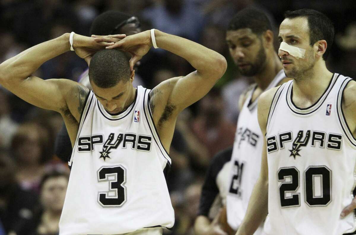 San Antonio Spurs' George Hill (3), Tim Duncan, center, and Manu Ginobili, of Argentina, right, walk up court during the fourth quarter of Game 4 of a Western Conference semifinals NBA basketball series, Sunday, May 9, 2010 in San Antonio. Phoenix won 107-101, winning the series 4-0. (AP Photo/Steve Nurenberg)