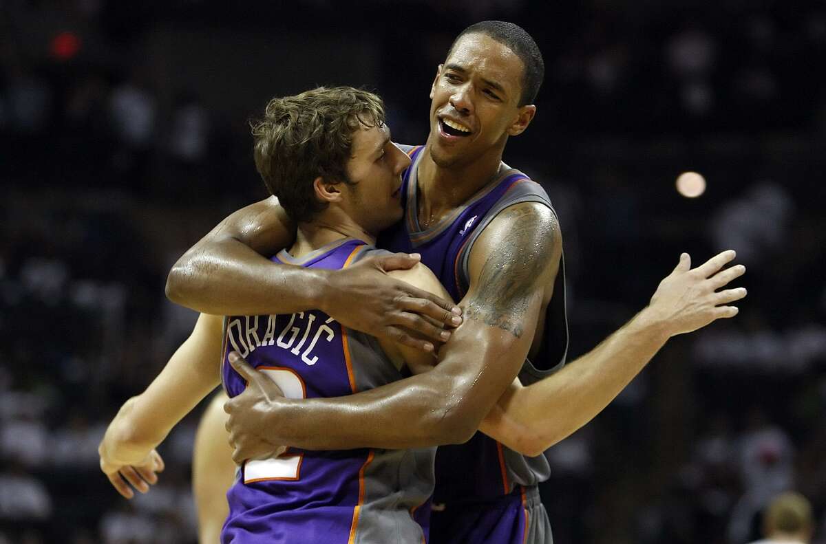 Phoenix Suns' Channing Frye (right) hugs teammate Goran Dragic after the Suns defeated the Spurs 110-96 in Game 3 of the Western Conference semifinals at the AT&T Center on Thursday, May 7, 2010. Dragic was instrumental in the defeat. Kin Man Hui/kmhui@express-news.net