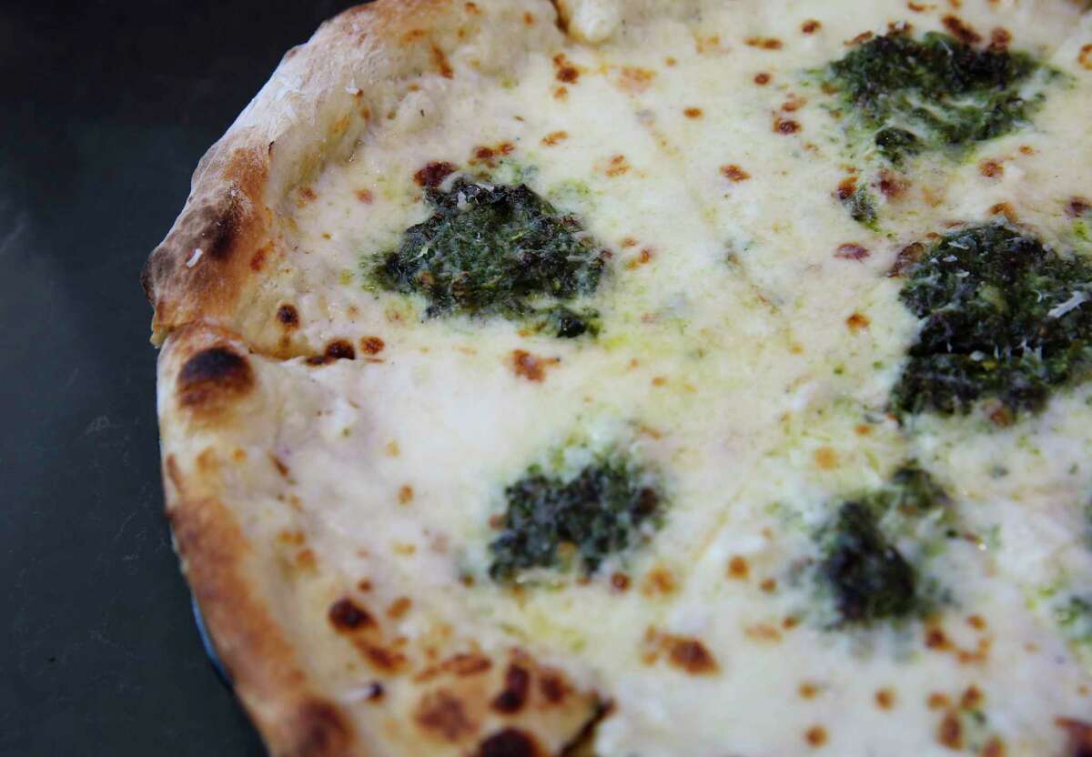 Pesto pizza from Pala, with a menu from chef Ryan Pera of Coltivare, is found in Terminal C-North at George Bush Intercontinental Airport.