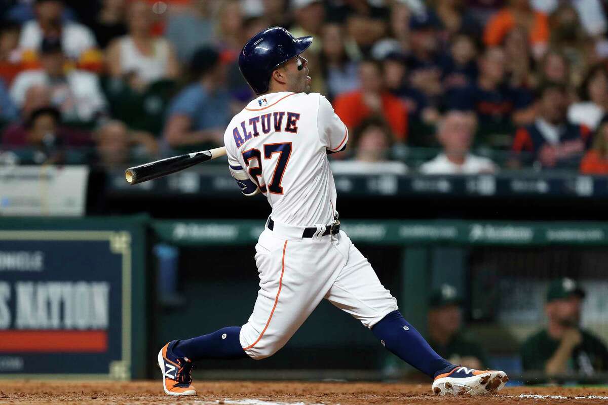 Houston Astros second baseman Jose Altuve (27) hits a home run during the eighth inning as the Houston Astros take on the Oakland Athletics at Minute Maid Park Saturday, April 29, 2017 in Houston. ( Michael Ciaglo / Houston Chronicle)