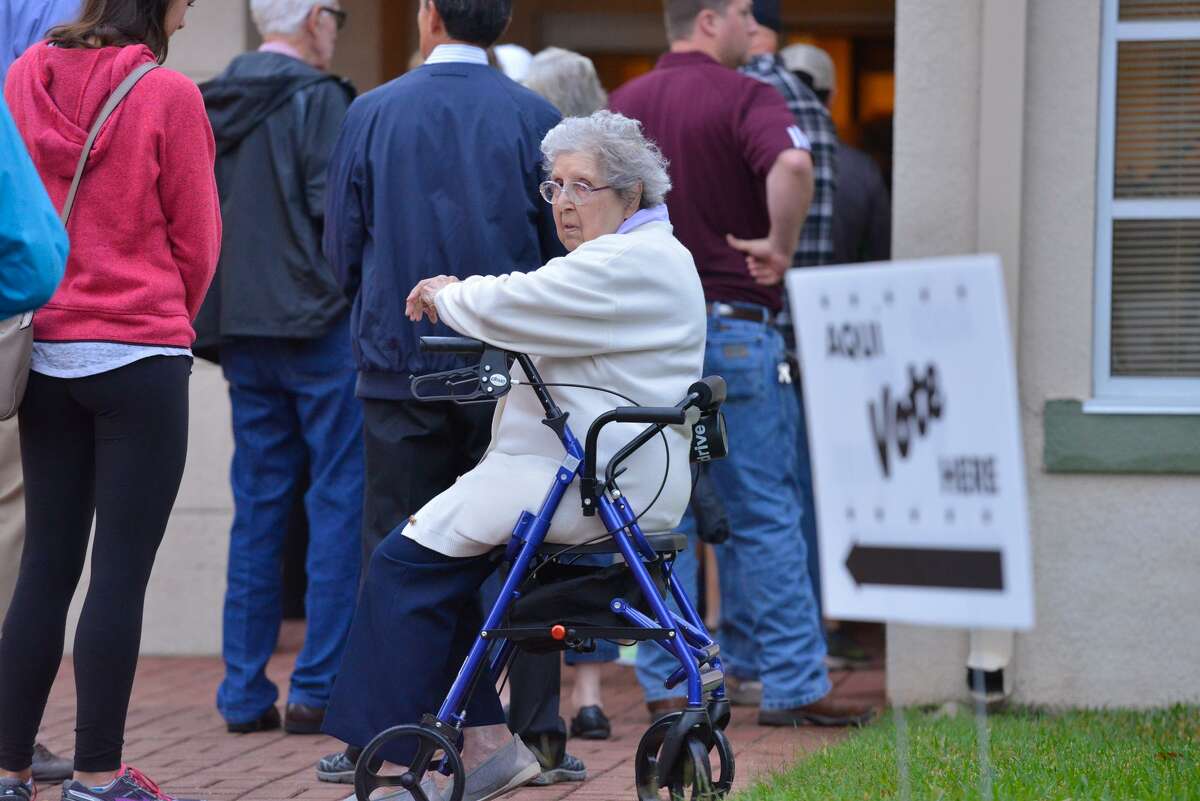 Yolanda Rusinko waits to vote at the Hollywood Park City Hall in November of 2016. The Texas Senate tentatively approved a bill that would ban straight-ticket voting, one step closer for Gov. Greg Abbott to sign it into law. Supporters of HB 25 say all races on ballot are important and that voters will be more educated on candidates instead of relying purely on a partisan basis, but opponents argue it will lead to voter suppression of minority voters.