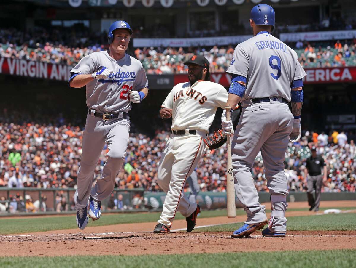 Dodgers' Chase Utley, scores from 3rd base on a wild pitch in the third inning, as the San Francisco Giants take on the Los Angeles Dodgers in MLB action at AT&T Park in San Francisco, Ca. on Wednesday May 17, 2017.