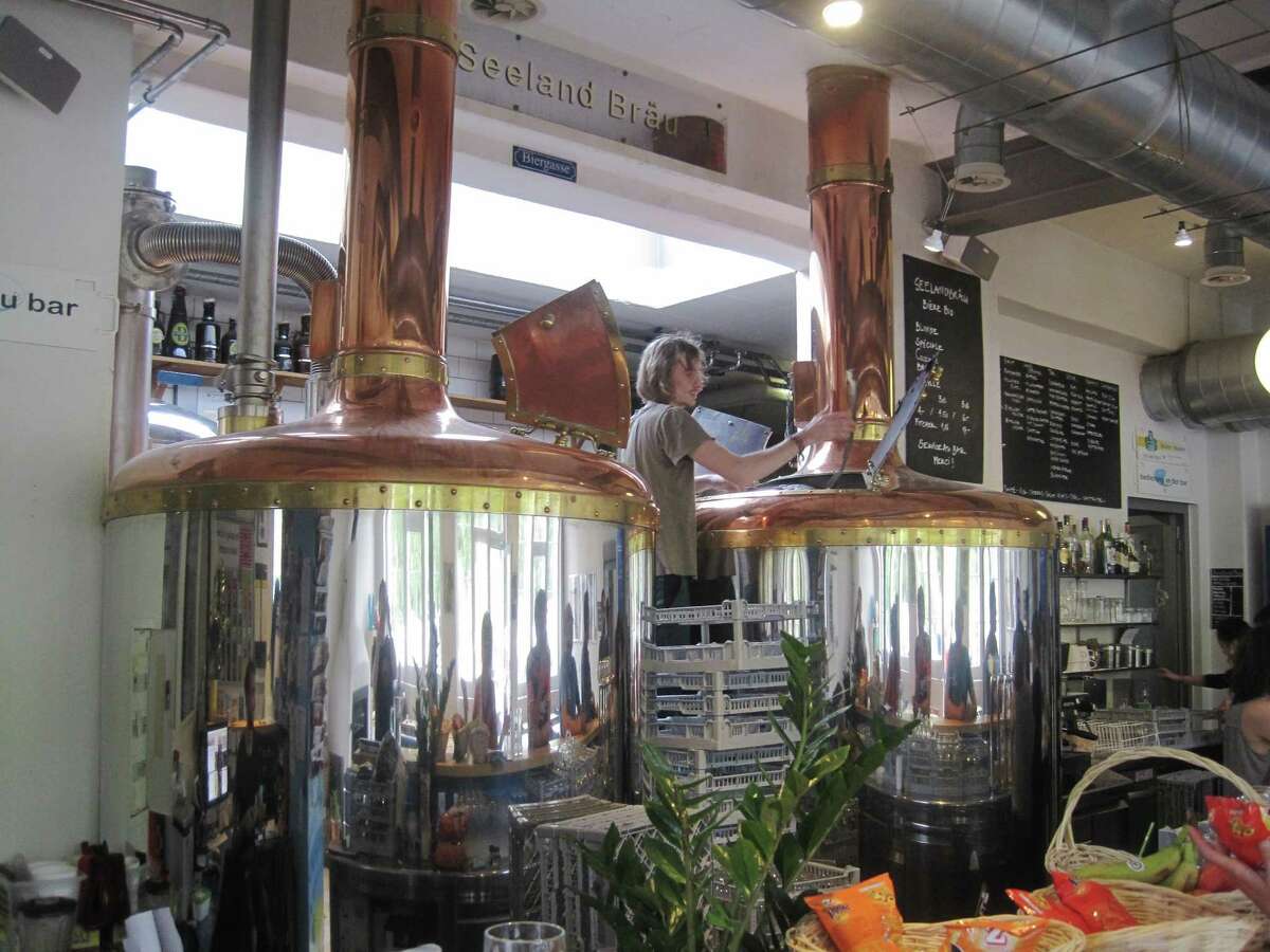 The brewing system at Seeland Bräu in Biel, Switzerland, is about as close to the bar as possible while still allowing brewing during business hours.