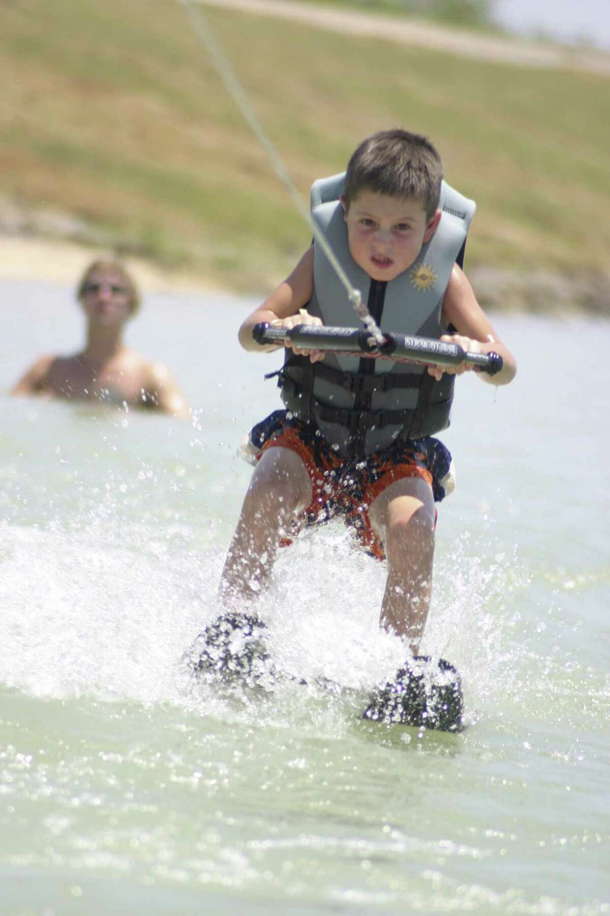 A Texas Ski Ranch camper learns to waterski during a summer program. The 70-acre park also offers cable system wakeboarding, “snow” boarding, and a skate and trampoline park.