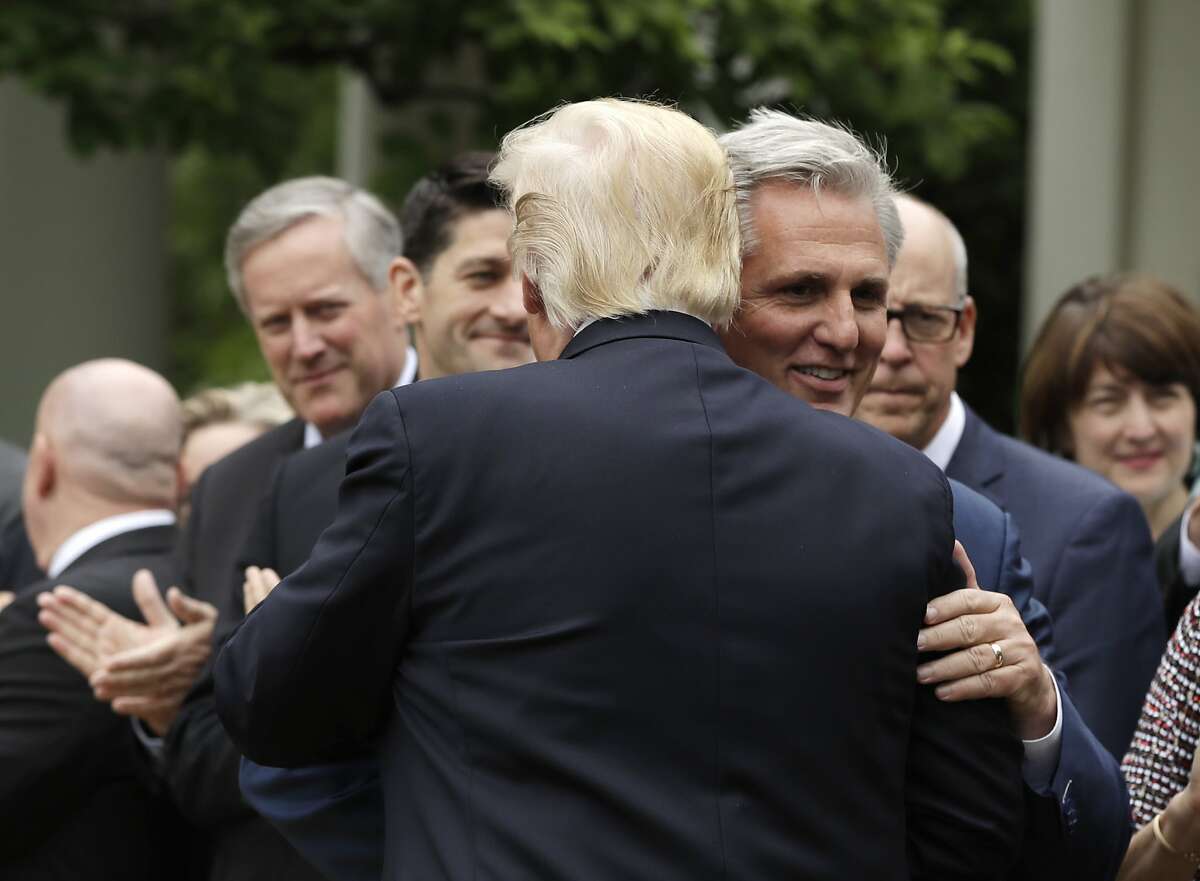 President Donald Trump hugs House MaJority Leader Kevin McCarthy of Calif. in the Rose Garden of the White House in Washington, Thursday, May 4, 2017, after the House pushed through a health care bill. (AP Photo/Evan Vucci)