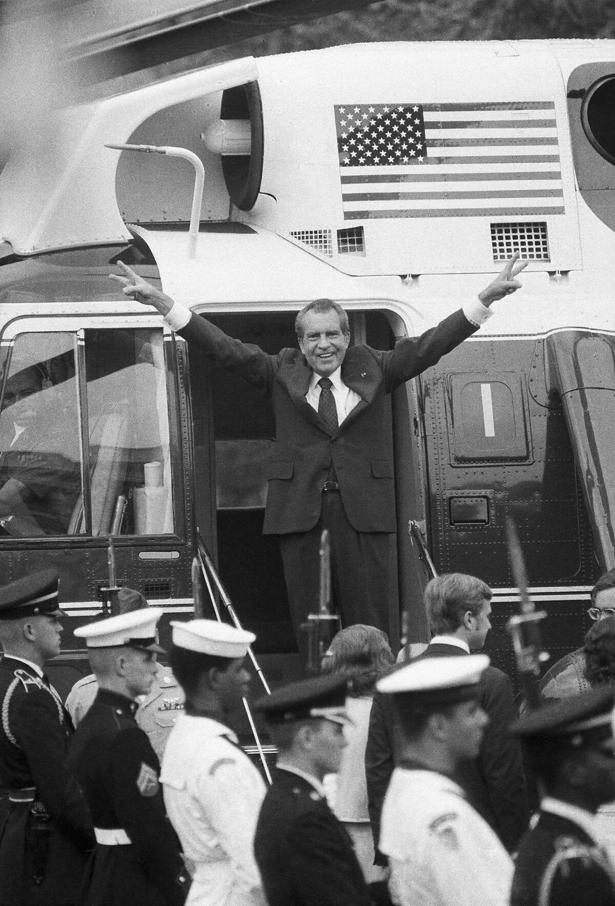 President Nixon gives his famous wave from the steps of Marine One after his resignation as President of the United States.