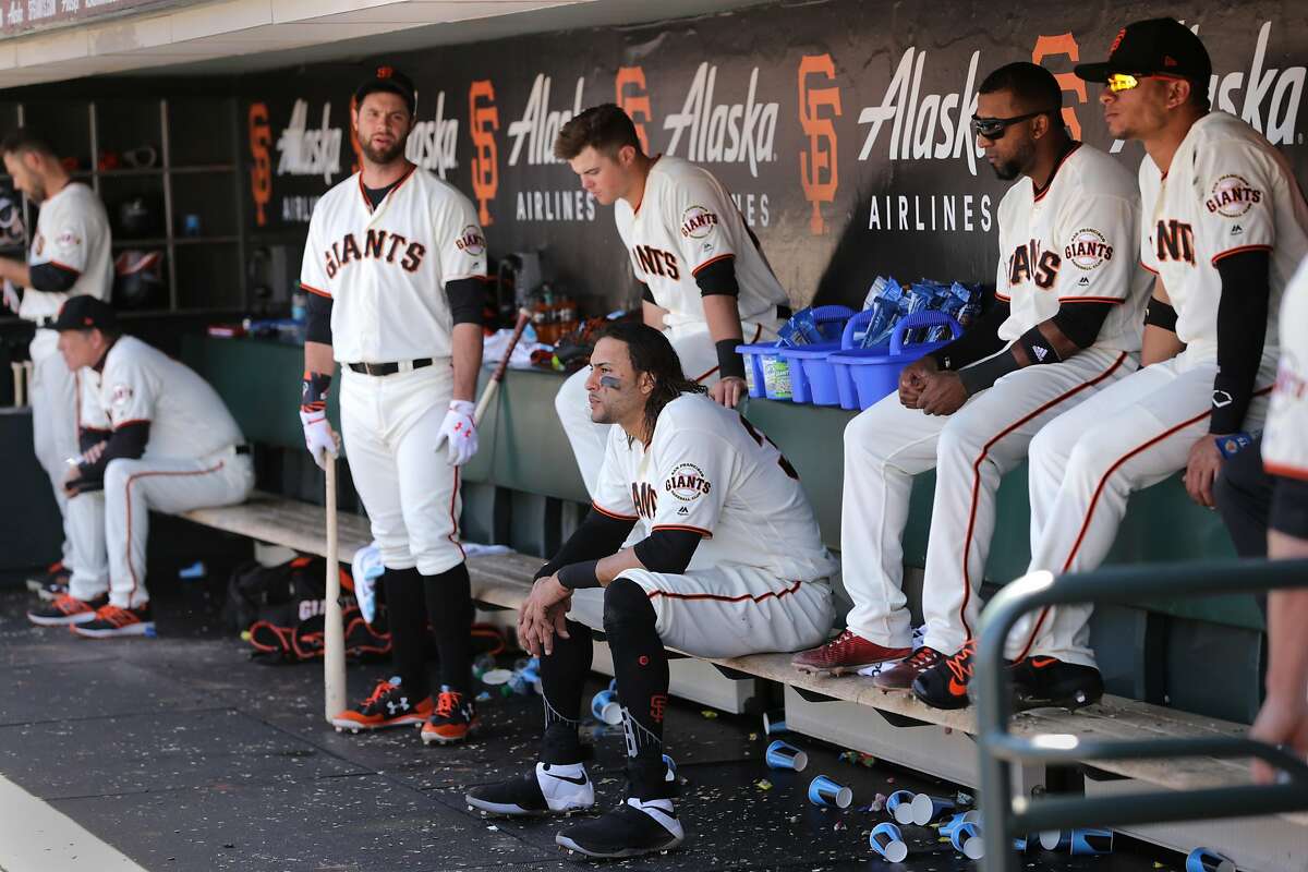 Brandon Belt, Michael Morse and Joe Panik, (center) in the dugout during the top of the 9th innning, as the San Francisco Giants went on to lose to the Los Angeles Dodgers 6-1 in MLB action at AT&T Park in San Francisco, Ca. on Wednesday May 17, 2017.
