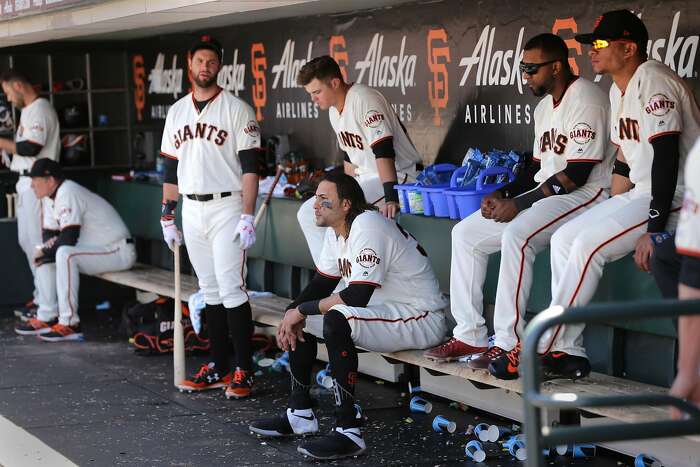 Alonso wears catcher's gear in the dugout 