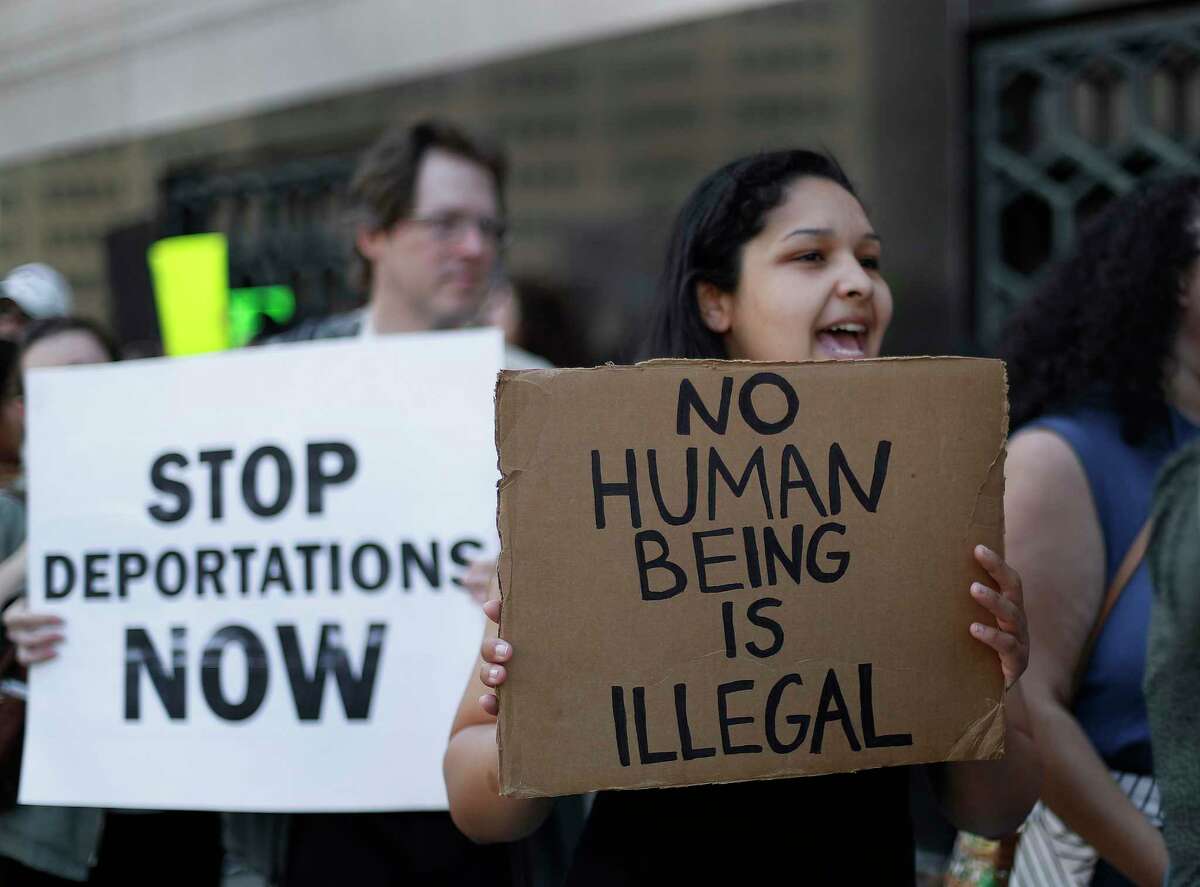 FILE - In this Tuesday, May 16, 2017, file photo, protesters rally outside a federal courthouse in Detroit. Protesters rallied in hopes public outcry will again delay the deportation of Jose Luis Sanchez-Ronquillo from the United States to Mexico. U.S. immigration arrests increased nearly 40 percent in early 2017 as newly emboldened agents under President Donald Trump detained more than 40,000 people suspected of being in the country illegally, with a renewed focus on immigrants without criminal convictions. (AP Photo/Paul Sancya, File)