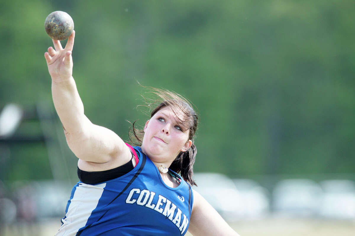 BRITTNEY LOHMILLER | blohmiller@mdn.net Coleman's Madalyn Badgero releases the shot put during a Wednesday afternoon track meet against Houghton Lake.